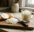 A medium onion typically yields approximately 2/3 cup (about 10 to 11 tablespoons) of chopped onion, or approximately 1/2 cup of finely diced onion. In raw culinary weight, one unpeeled medium onion weighs roughly 8 ounces (225 grams), producing about 5.5 to 6 ounces (155 to 170 grams) of trimmed, recipe-ready chopped onion.